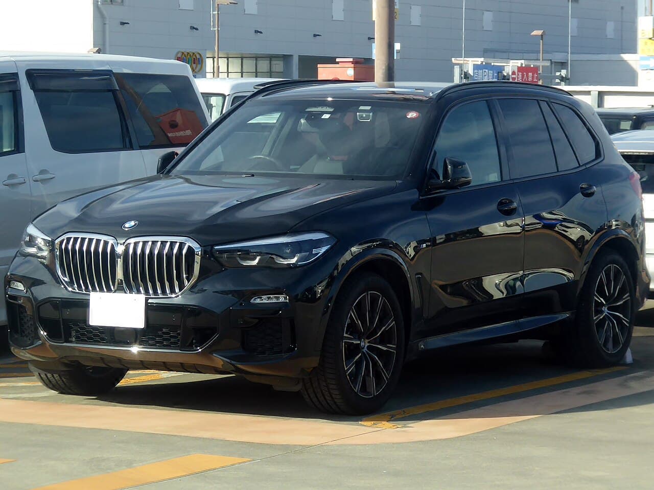 Black BMW X5 G05 viewed from the front side